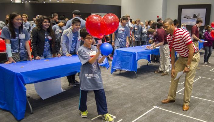 6th Grade TAME Student Ethan Garcia Launches Airship in Engineering Design Challenge at State Math and Science Competition, While Lockheed Martin Engineer Judges