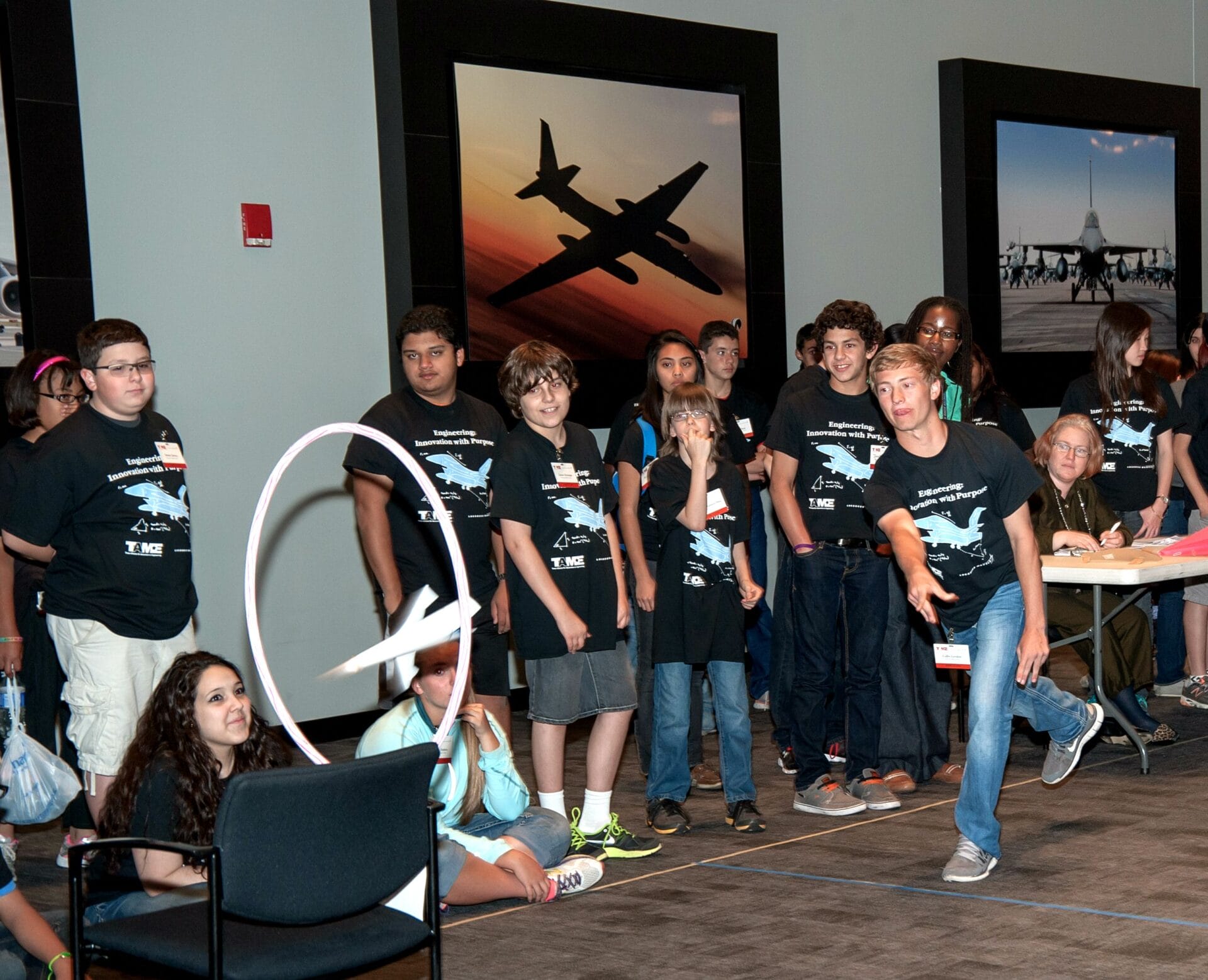 Students fly stunt planes in the Engineering Design Challenge at TAME's 2014 State Math and Science Competition.