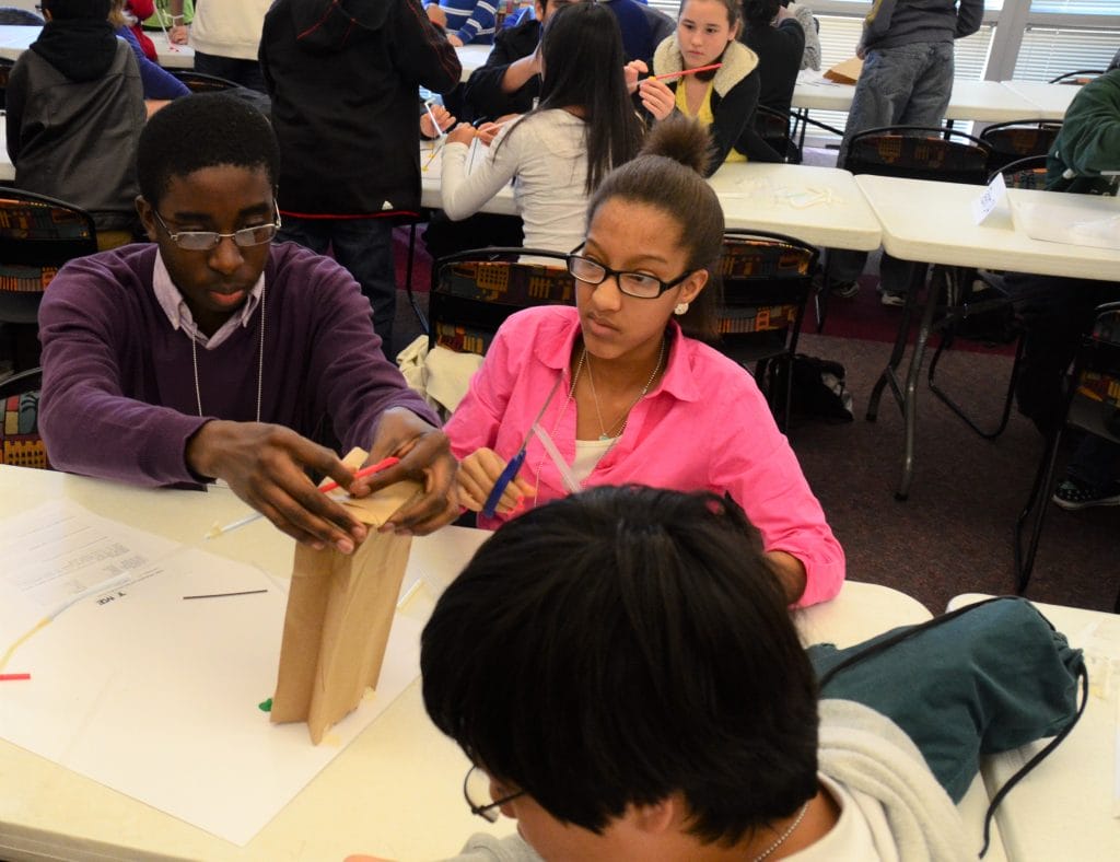 Photo of two students building their BB Coaster prototype