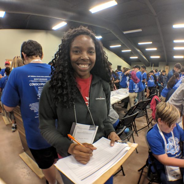 A ConocoPhillips employee volunteers as an Engineering Design Challenge Judge at the 2019 State STEM Competition.